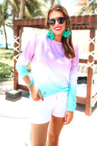 a relaxed fit, a trendy color gradient ombre design, and ribbed neckline, cuffs, and hem