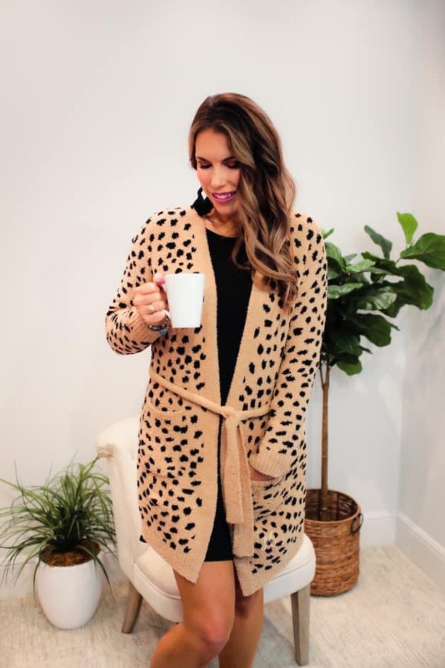 long sleeve wrap robe patterned with animal print, a straight mid-thigh length hemline, and a relaxed open front silhouette with a belt closure made of super soft material in brown spotted pattern