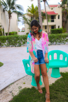 lightweight breezy material, multi-colored tie-dye print, half sleeves, and a relaxed open-front silhouette