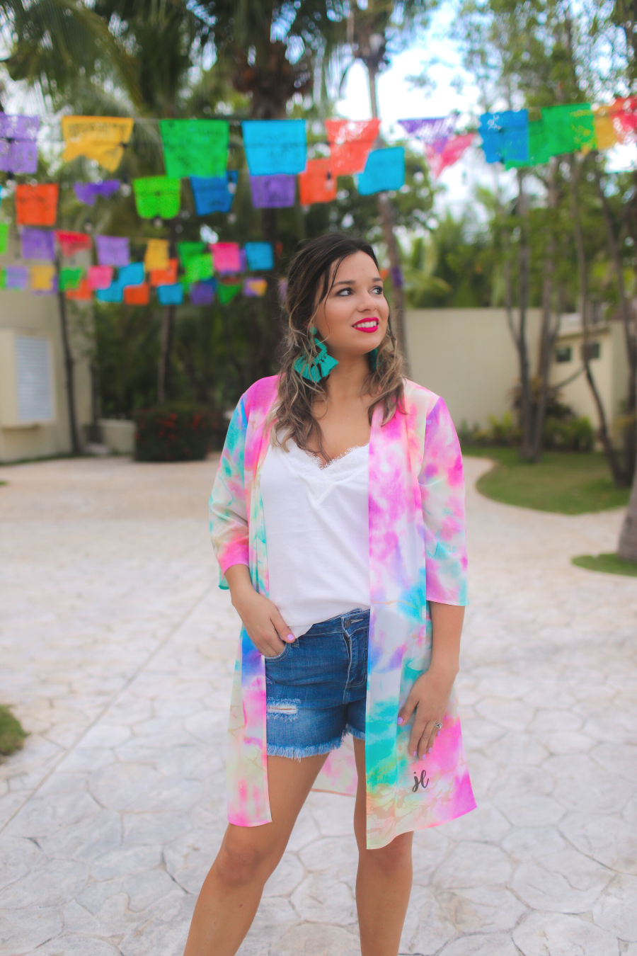 lightweight breezy material, multi-colored tie-dye print, half sleeves, and a relaxed open-front silhouette