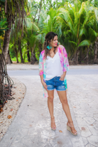 lightweight breezy material, multi-colored tie-dye print, half sleeves, and a relaxed open-front silhouette