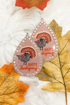 lightweight, seasonal-inspired leopard-theme teardrop-shaped earrings outlined in rhinestones with a fish hook in mauve leopard pumpkin