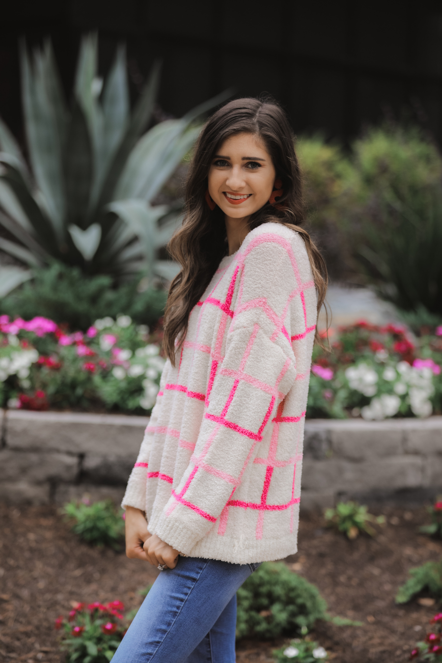 two-tone pink plaid patterned long sleeve sweater made of super soft material with a rounded neckline