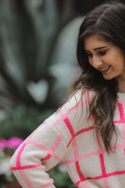 two-tone pink plaid patterned long sleeve sweater made of super soft material with a rounded neckline