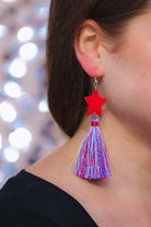 ultra-lightweight hook-style drop earring with a red star topper cascading down into a soft red, white, and blue tassel mix and gold accent