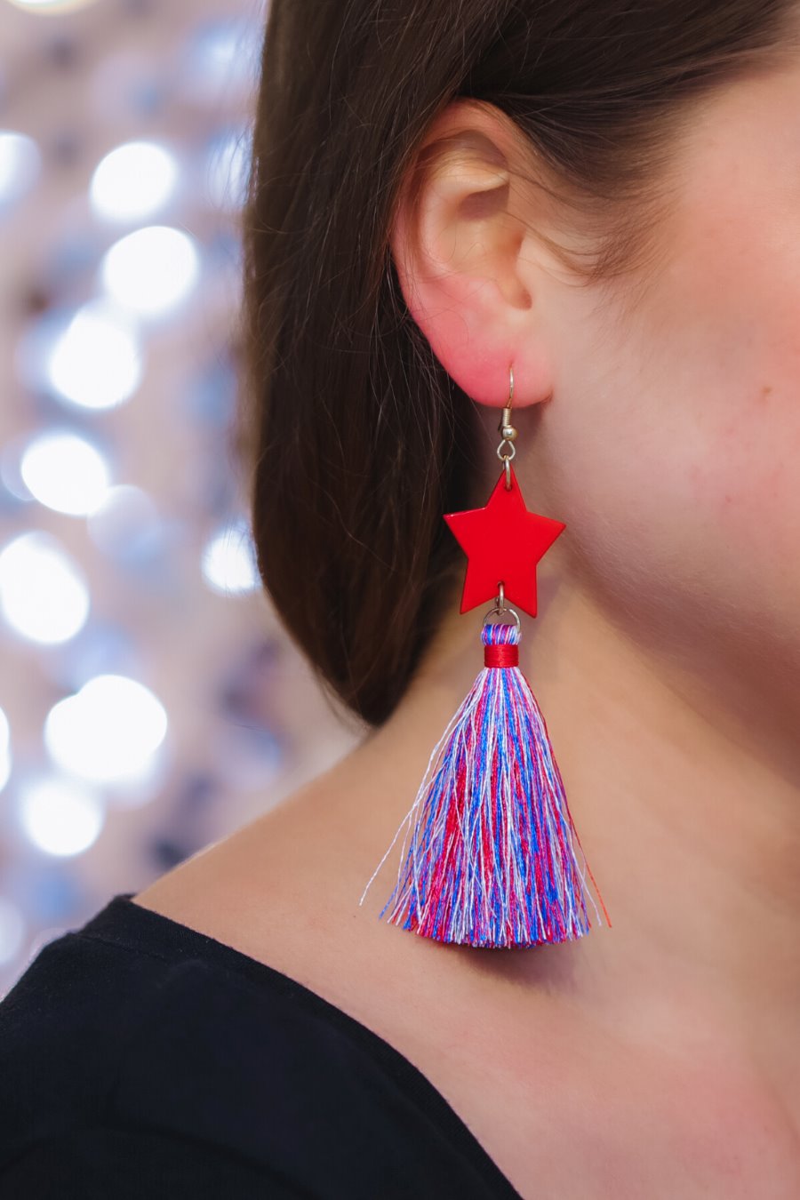ultra-lightweight hook-style drop earring with a red star topper cascading down into a soft red, white, and blue tassel mix and gold accent