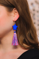 ultra-lightweight hook-style drop earring with a blue star topper cascading down into a soft red, white, and blue tassel mix and gold accent