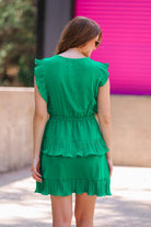 ruffled sleeve dress with layered pleats, an elastic waistband, and a lined bottom in green
