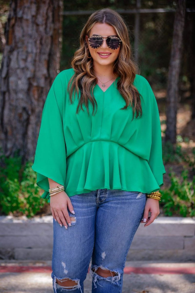 dolman long sleeves top with a plunging v-neckline and a gathered waistline in green