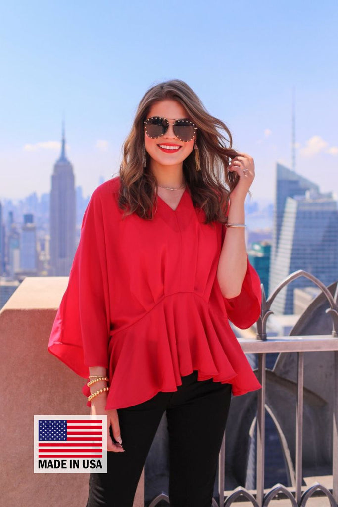 dolman long sleeves top with a plunging v-neckline and a gathered waistline in red