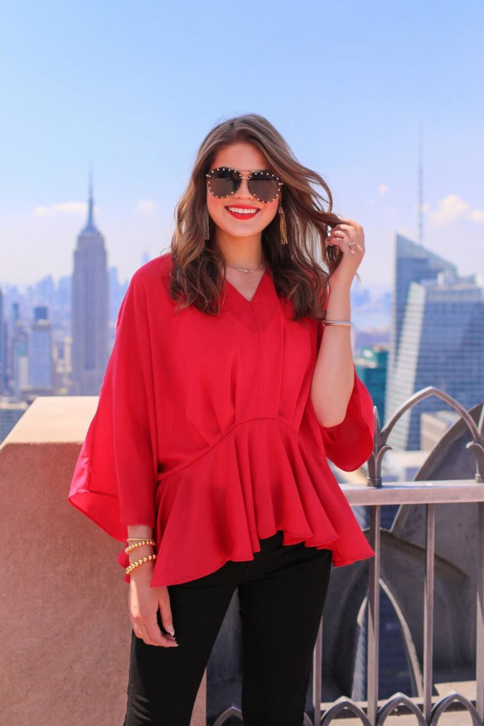 dolman long sleeves top with a plunging v-neckline and a gathered waistline in red