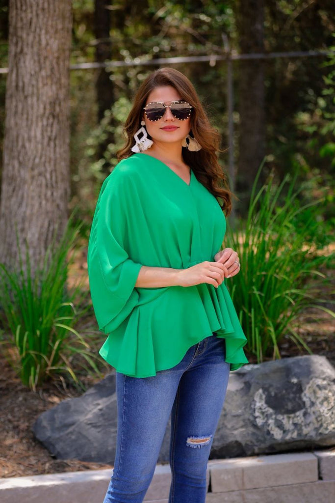 dolman long sleeves top with a plunging v-neckline and a gathered waistline in green