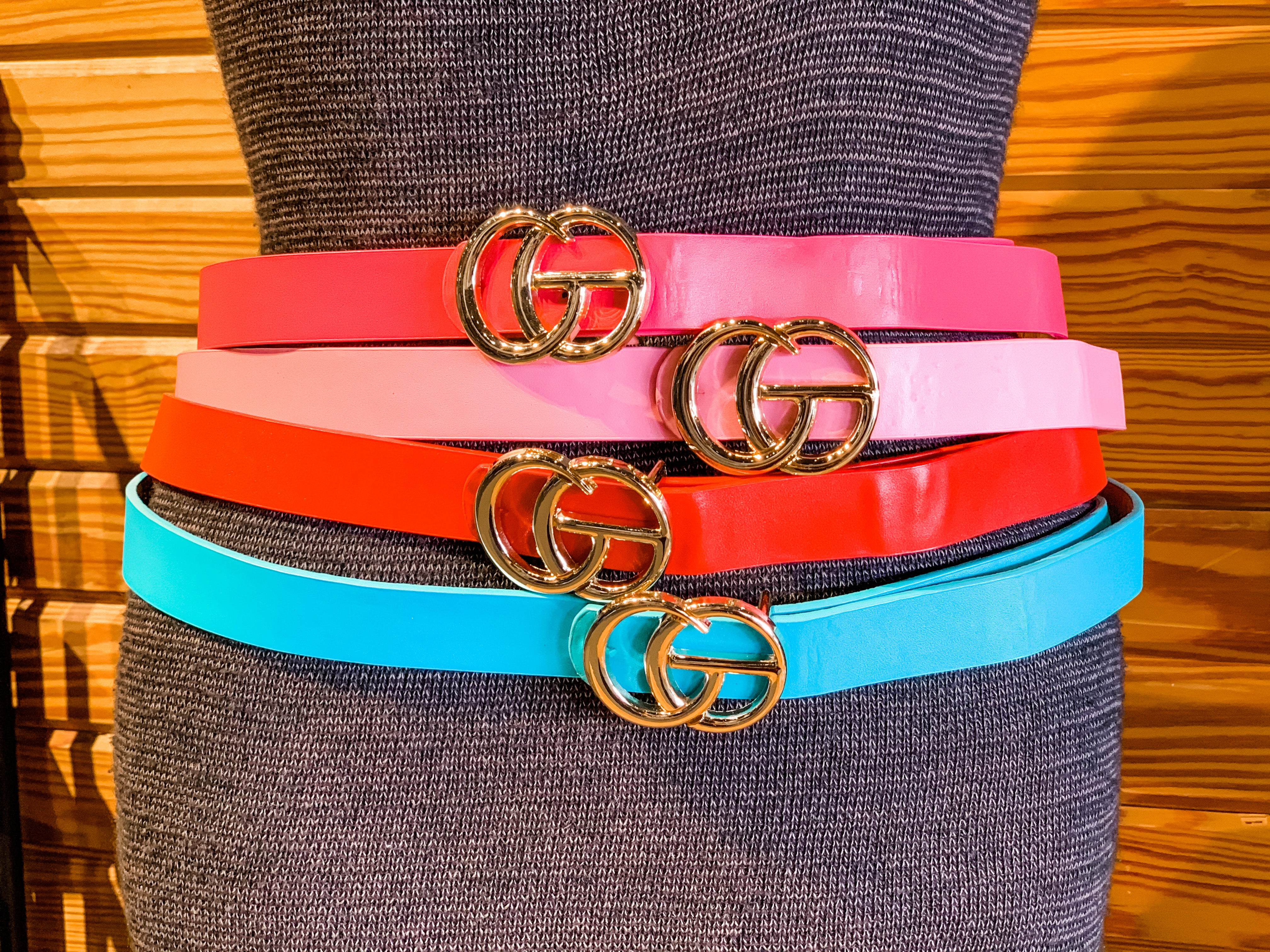 double metal ring faux leather buckle belt in hot pink, light pink, red, and turquoise