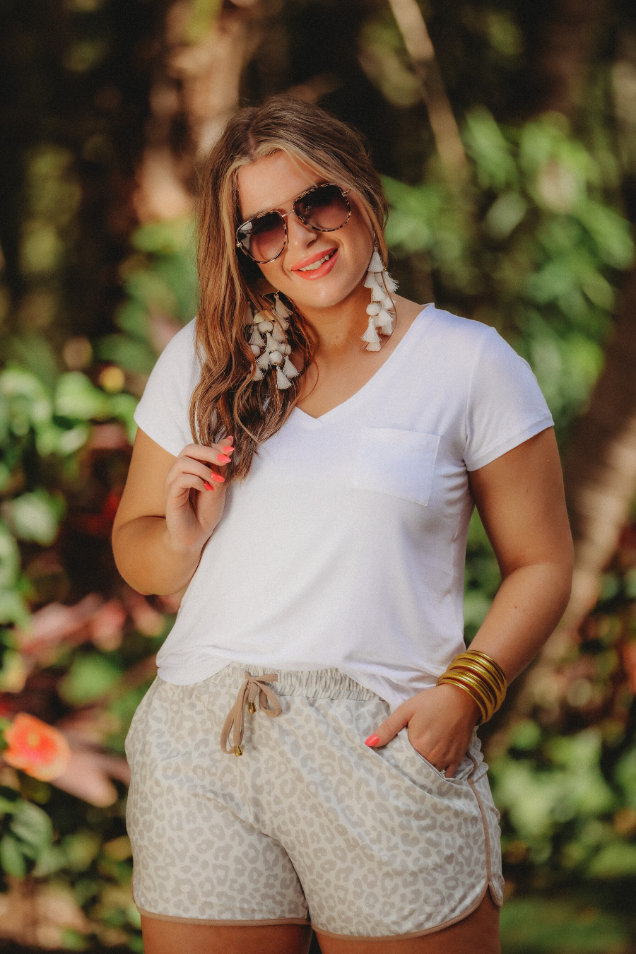 mid-rise, tie waist drawstring, side pocks, & relaxed fit on a neutral leopard print