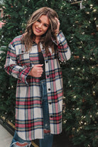 a long-sleeve shacket with a festive plaid print, cuffs, a button-down front to a high-low split hem, a collared neckline, button-closure chest pockets, convenient side pockets on a seasonal plaid print warm fabric