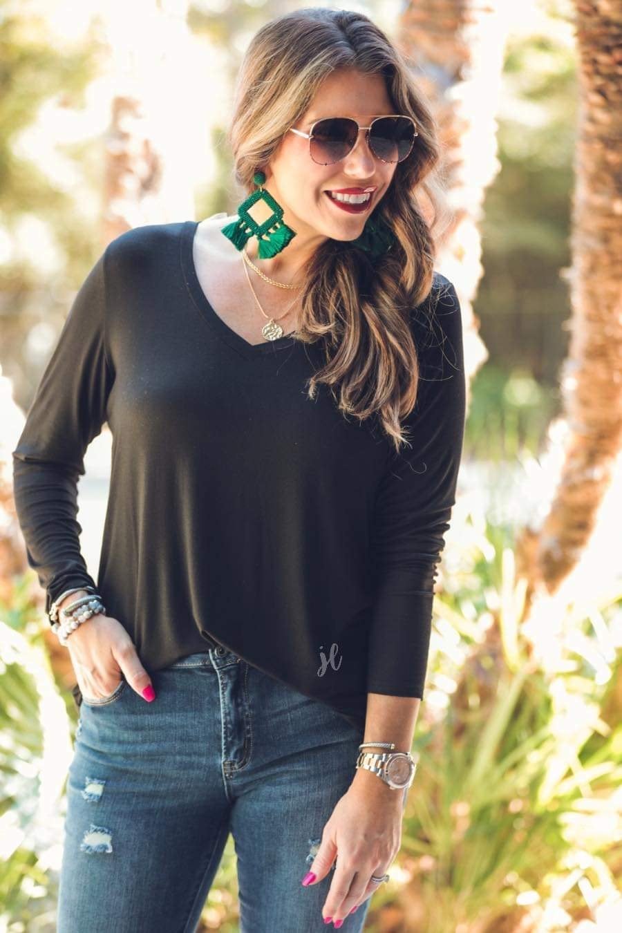 long sleeve tee with a v-neckline and a rounded hemline that fits slightly oversized with a relaxed fit in black