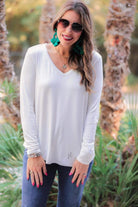 long sleeve tee with a v-neckline and a rounded hemline that fits slightly oversized with a relaxed fit in ivory