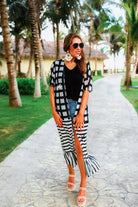 lightweight material patterned with checkered and horizontal stripes and a ruffled hemline