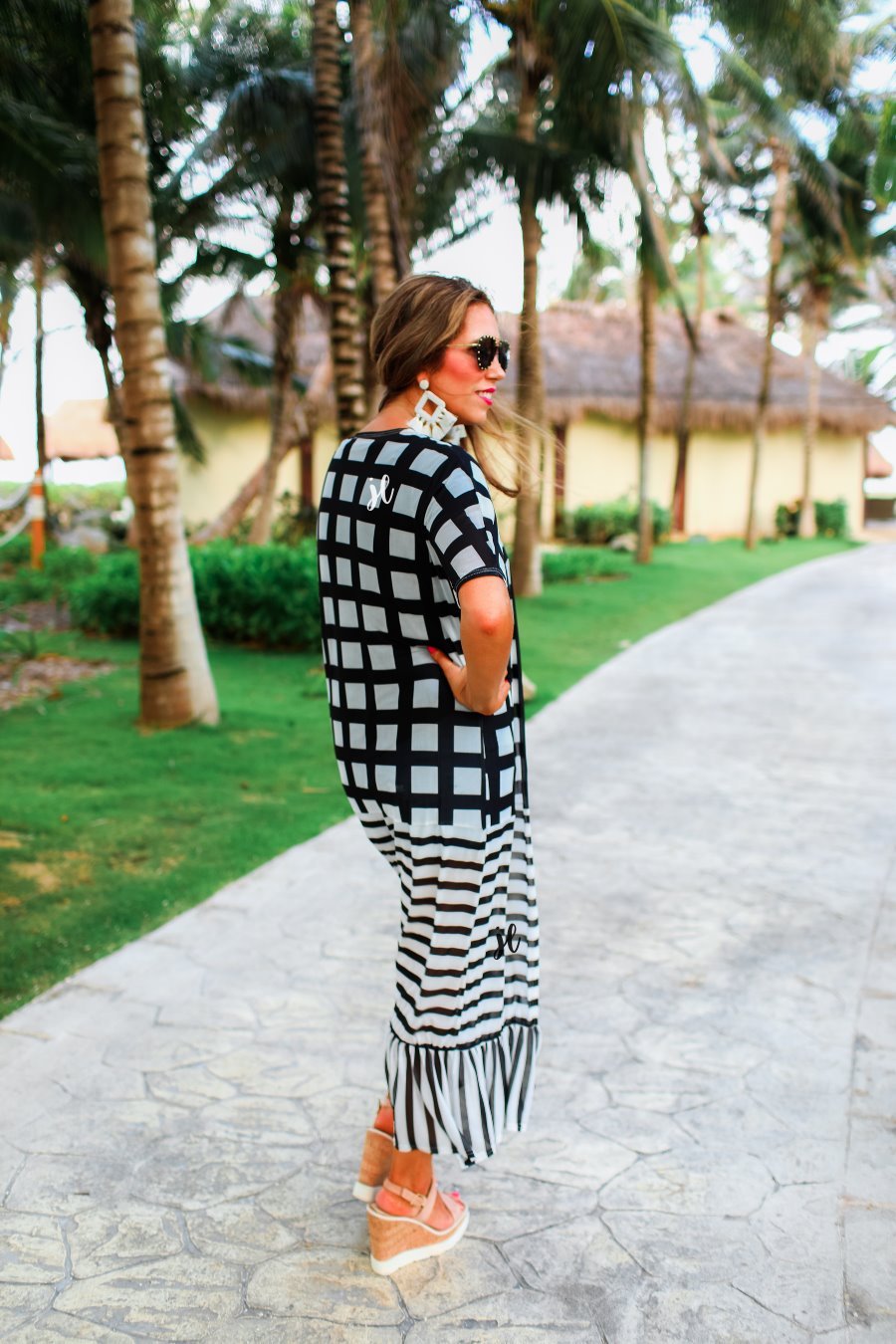 lightweight material patterned with checkered and horizontal stripes and a ruffled hemline