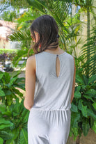 made in USA sleeveless one-piece jumpsuit with 2.5" straps, a keyhole button back, an elastic waist, flare leg, and pockets in grey