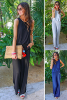 a sleeveless one-piece jumpsuit with wide 2.5" shoulder straps, a rounded neckline, elastic waist, side pockets, keyhole button back, and a relaxed flare leg silhouette in black, grey, and navy