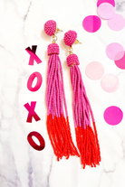 pink and red ombré beaded tassels with a pink beaded stud, comfort replacement earring back, and plastic disk stopper style in silver and gold