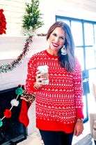 a red long-sleeve tunic made from comfy material with comfy material with a sublimation-printed Christmas pattern print (geometric designs, reindeer, Santa's sleigh, snowflakes, and trees) sublimation detail, ribbed accents (cuffs, neckline, and hem), side slits, and a relaxed fit