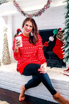 a red long-sleeve tunic made from comfy material with comfy material with a sublimation-printed Christmas pattern print (geometric designs, reindeer, Santa's sleigh, snowflakes, and trees) sublimation detail, ribbed accents (cuffs, neckline, and hem), side slits, and a relaxed fit