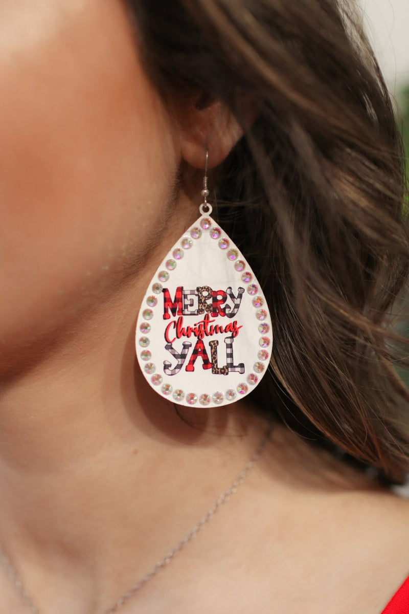 a fish hook back teardrop shape earring with a rhinestone outline and 'MERRY CHRISTMAS Y'ALL' written in alternating prints of red/black checkered, black/white checkered, brown leopard, and solid red