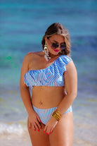 two-piece swimsuit with a ruffle bikini crop top and a full coverage high-waisted bottom on a blue and white striped pattern