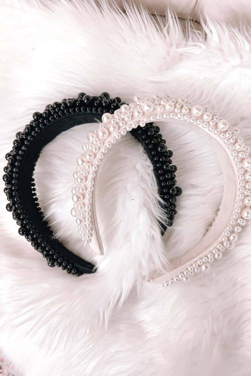 a soft, structured headband adorned with beautifully clustered pearls in varying sizes in black and ivory