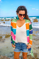 a lightweight open-front cardigan with a relaxed fit, breathable knit fabric, and bold multicolored vertical stripe design in dusty pink, kelly green, periwinkle, sage green, tangerine, and teal on a cream base