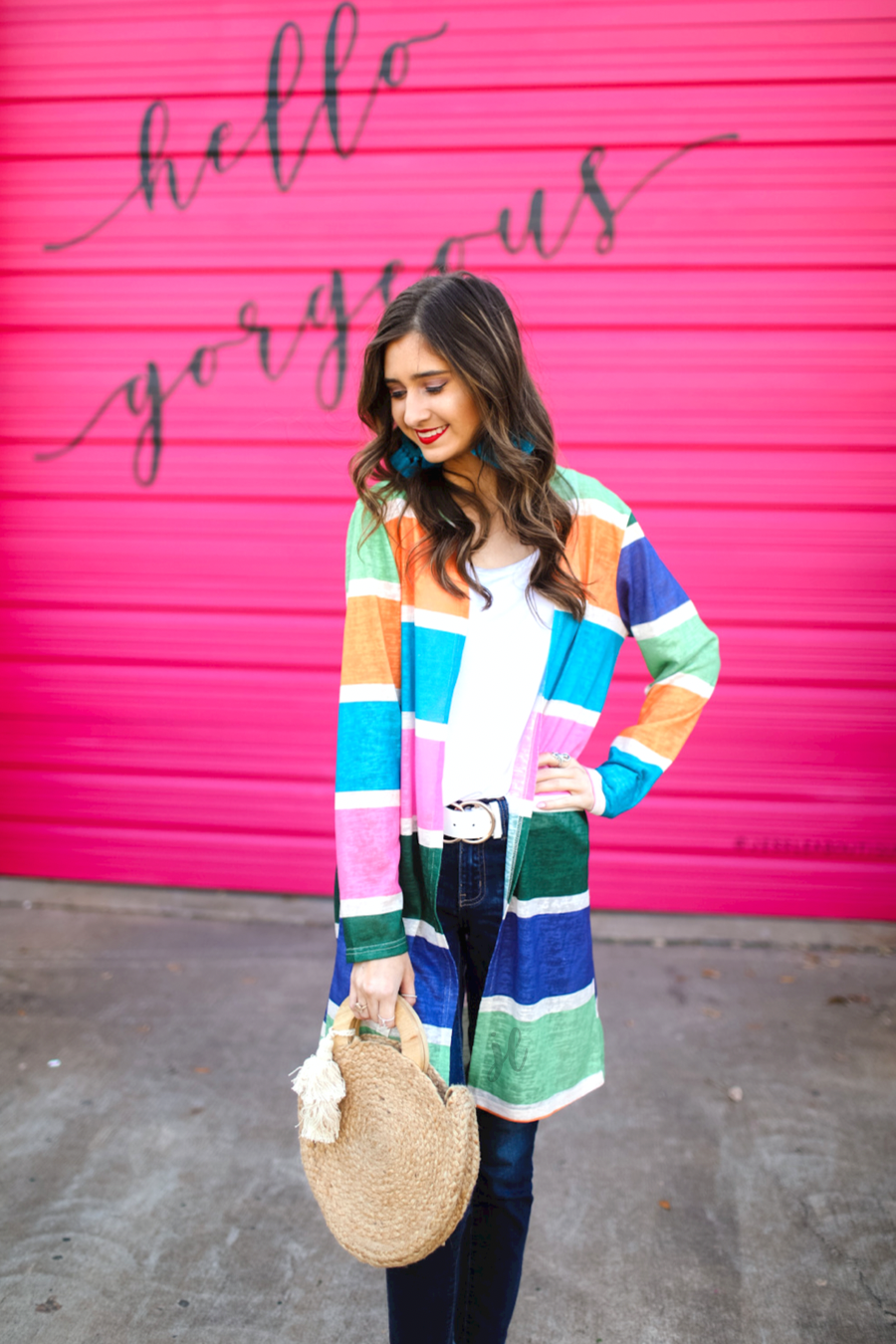 a lightweight open-front cardigan with a relaxed fit, breathable knit fabric, and bold multicolored vertical stripe design in dusty pink, kelly green, periwinkle, sage green, tangerine, and teal on a cream base