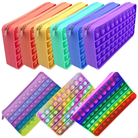 a waterproof silicone zippered pencil case with poppable bubbles, a discreet popping sound, a comfortable touch, compact storage for small essentials, and an endlessly reusable, dishwasher-safe design for versatile daily use, available in blue, mint, orange, purple, rainbow, rainbow pastel, red, tie dye pastel, and yellow
