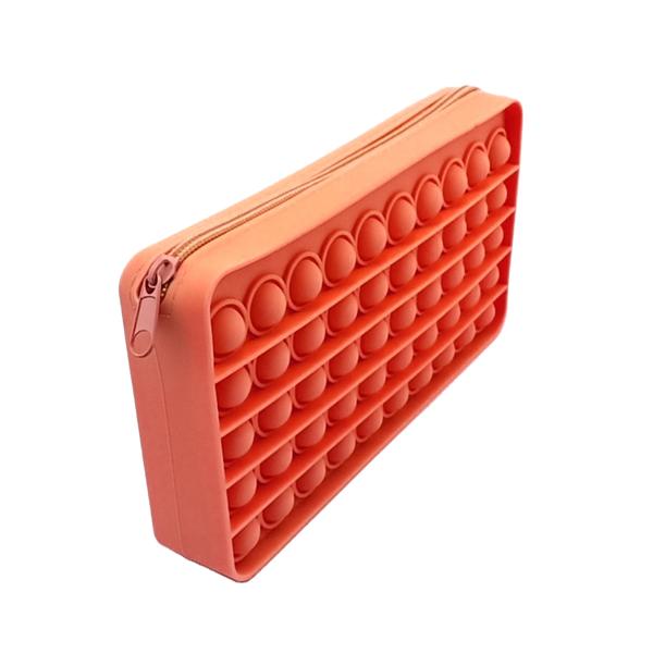 a waterproof orange silicone zippered pencil case with poppable bubbles, a discreet popping sound, a comfortable touch, compact storage for small essentials, and an endlessly reusable, dishwasher-safe design for versatile daily use