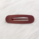 Raeh oversized spring back clip with curve design in burgundy
