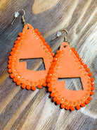 leather teardrop earrings with the State of Oklahoma cutout in the center, matching beading accent over the edges, and a fish hook