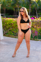 solid black two-piece triangle bikini with a back hook, removable padding, matching bottoms, and a sheer gold star pattern coverup