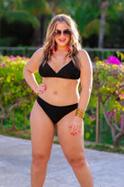 solid black two-piece triangle bikini with a back hook, removable padding, matching bottoms, and a sheer gold star pattern coverup