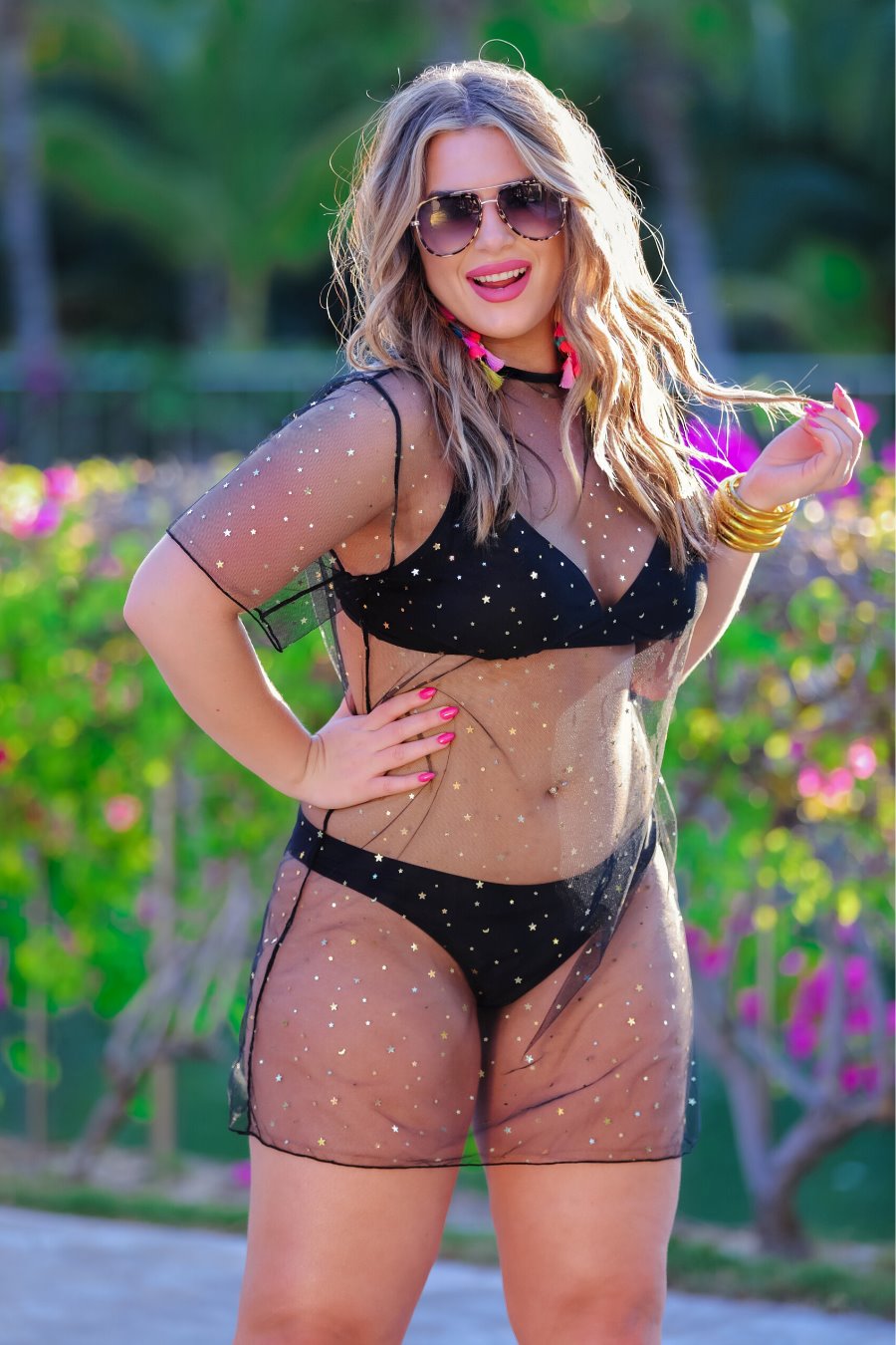 solid black two-piece triangle bikini with a back hook, removable padding, matching bottoms, and a sheer gold star pattern coverup