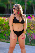 solid black two-piece triangle bikini with a back hook, removable padding, matching bottoms, and a sheer gold star pattern coverup