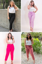high-waisted paper-bag silhouette pants with a ruffle trim and sash tie, lightweight drapey fabric, straight legs, side pockets polished with a flirty ruffle, and unlined for breezy comfort in black, lavender, pink, and rose