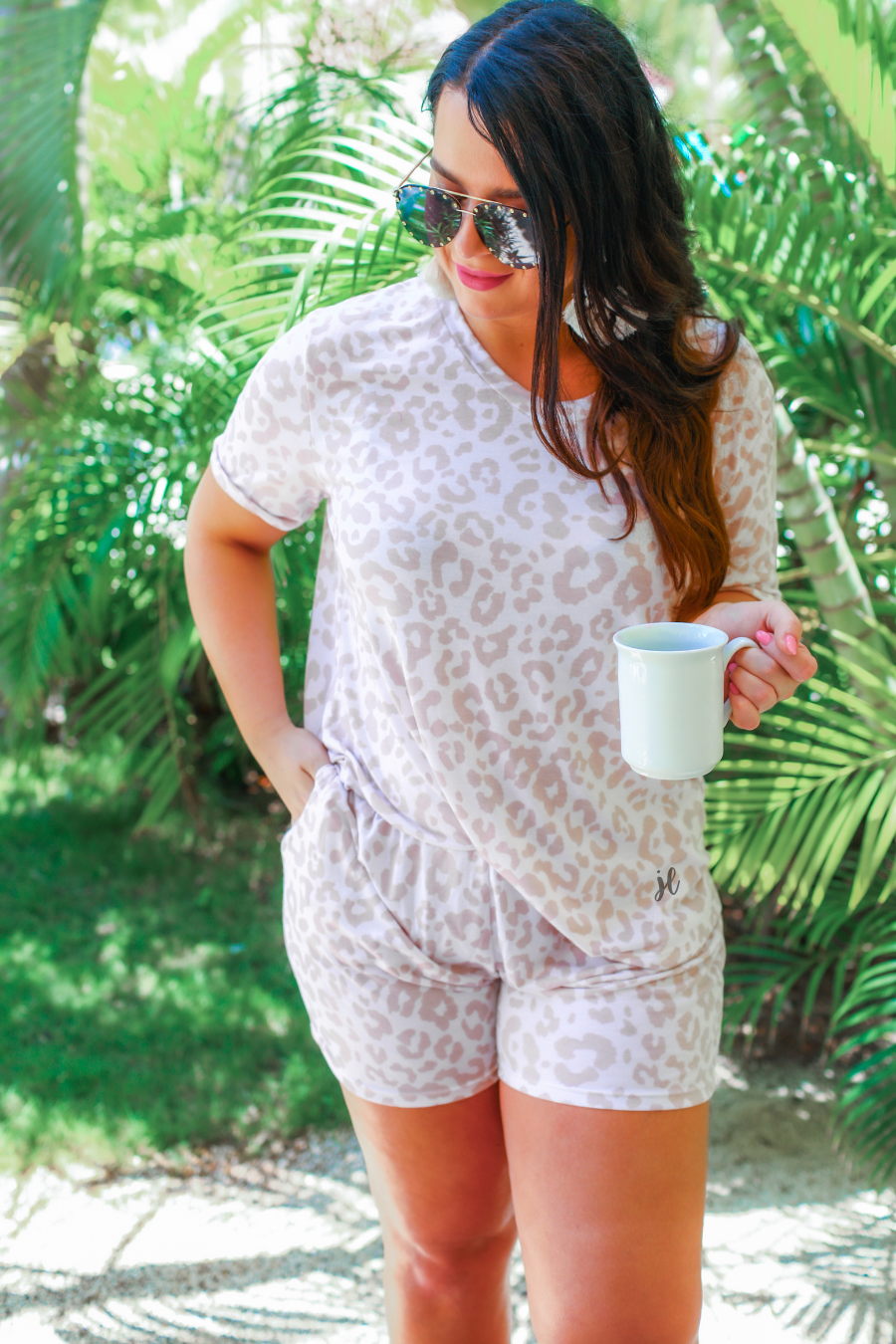 a neutral taupe animal print lounge set crafted from soft stretch fabric with a short-sleeve V-neck top, matching pull-on shorts, elastic waistband, side pockets, and relaxed fit