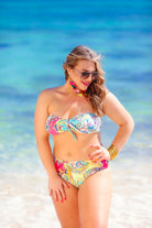 two-piece swimsuit with a sweetheart neckline bandeau top, a front tie detail, a flattering-hugging silhouette, removable padding, and a cheeky fit bottom on a multi-colored paisley print fabric