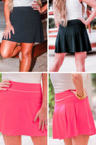 a slimming true to size solid color skort with built-in shorts, interior side pockets, and a pleated back in black and pink